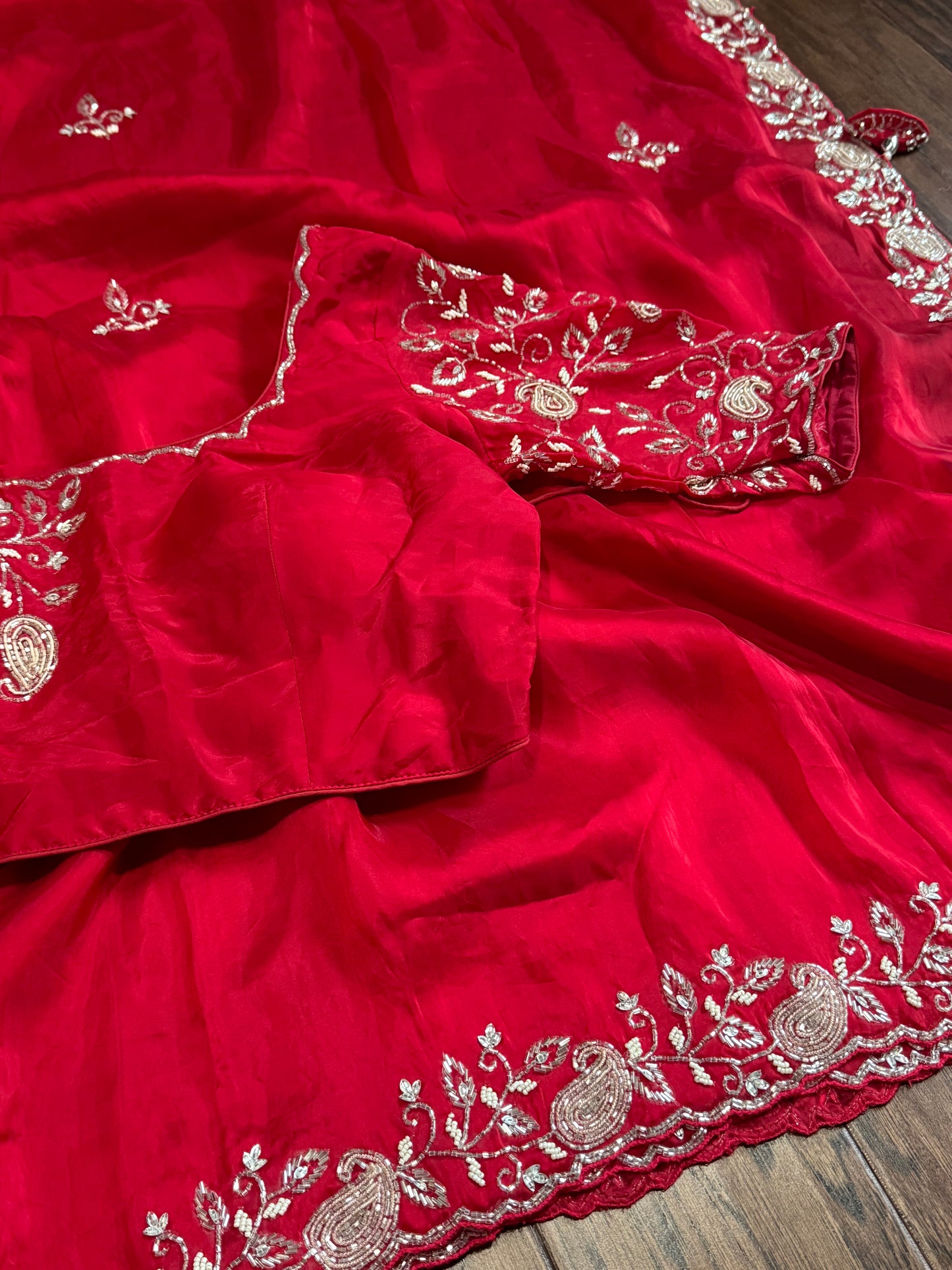 **New**Red satin organza saree with beads work and stitched blouse