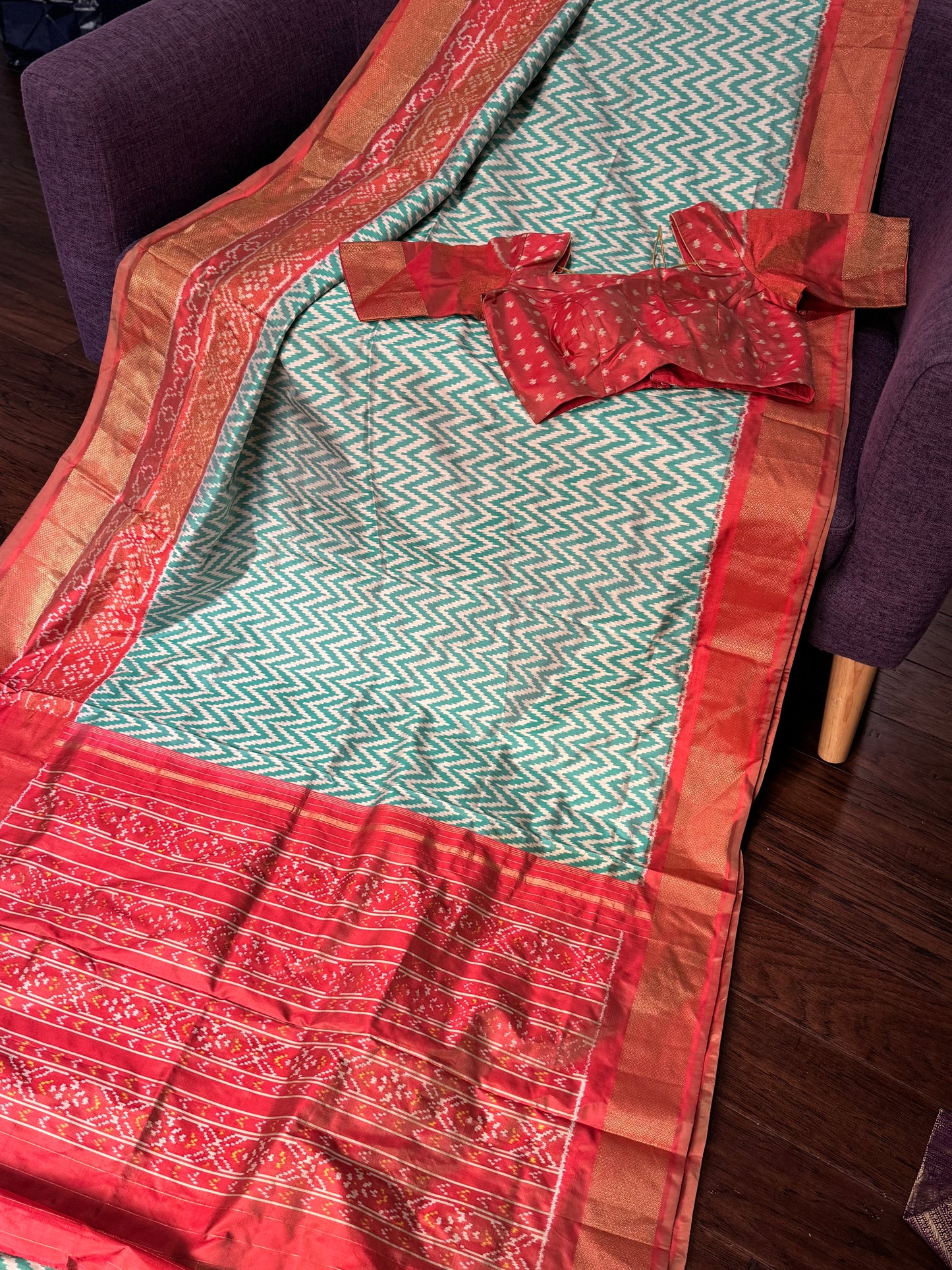 **New**sea Green ikkat saree with peach color boarder paired with stitched blouse