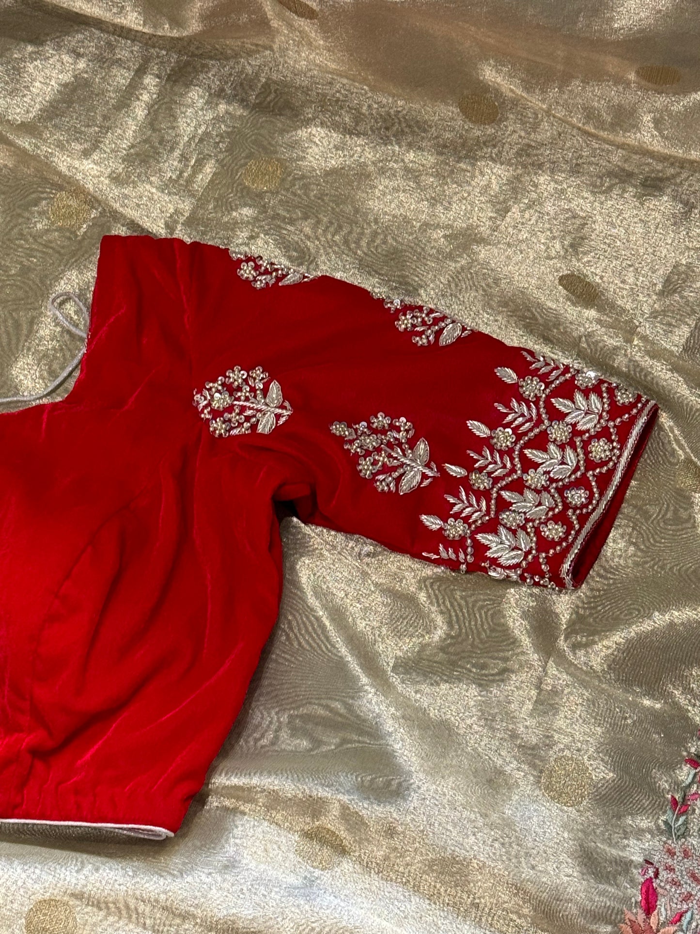 **New**Tissue saree with embroidery boarder paired with red velvet work blouse