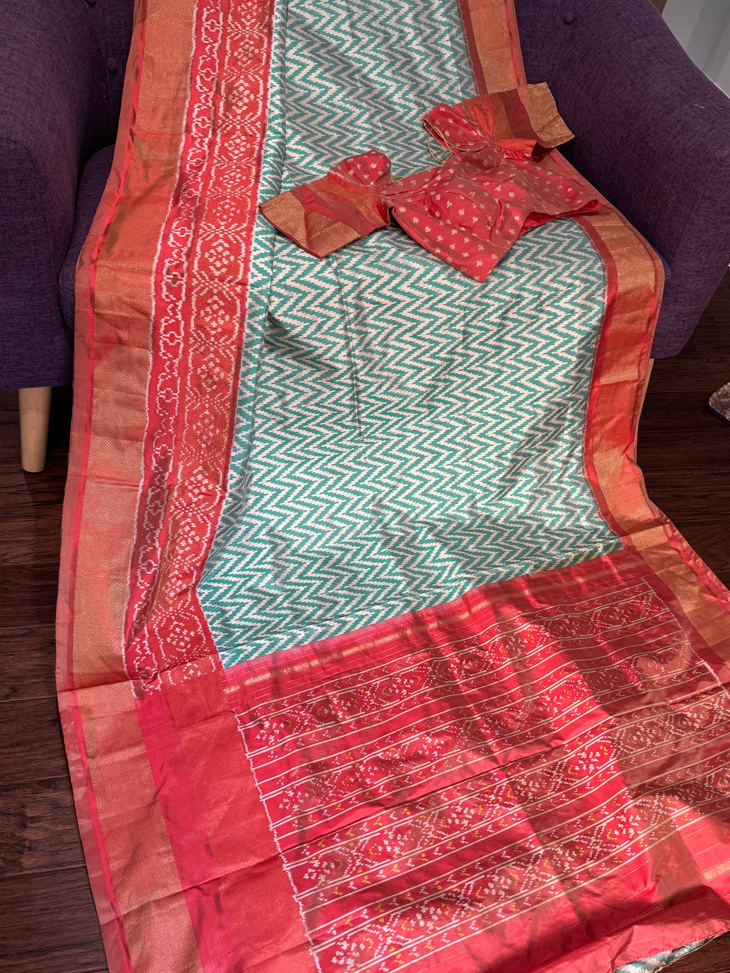 **New**sea Green ikkat saree with peach color boarder paired with stitched blouse