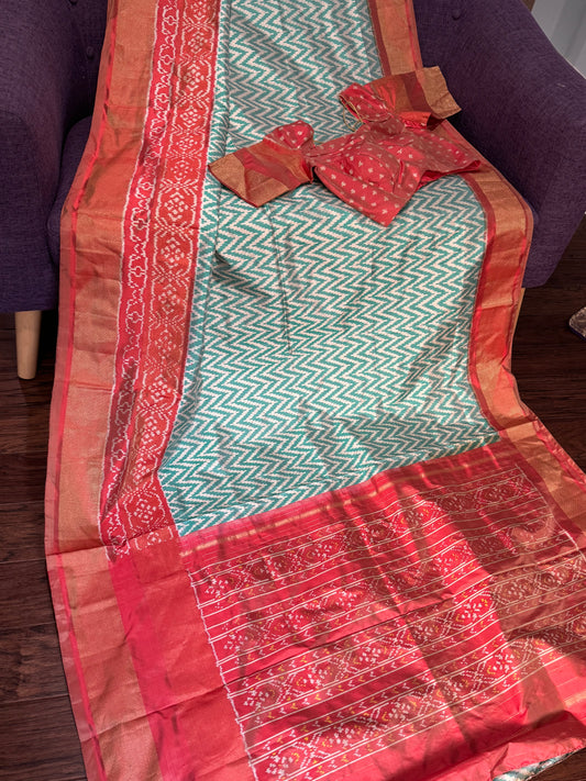 **New**sea Green ikkat saree with peach color boarder paired with stitched blouse