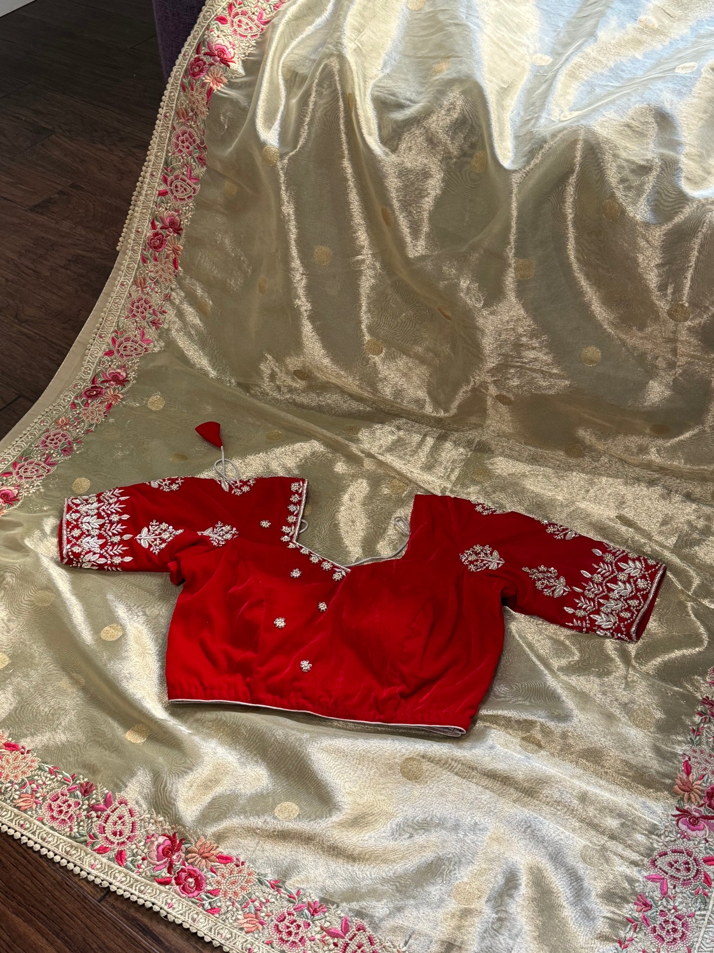 **New**Tissue saree with embroidery boarder paired with red velvet work blouse