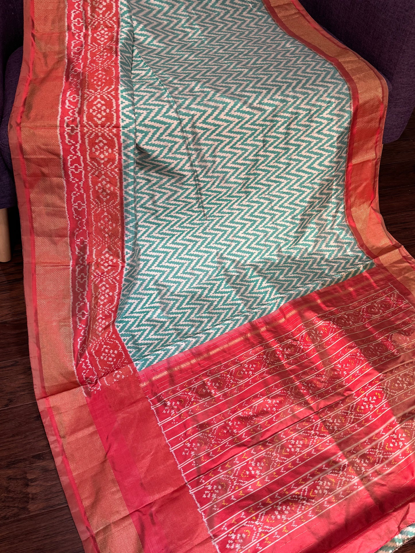 **New**sea Green ikkat saree with peach color boarder paired with stitched blouse